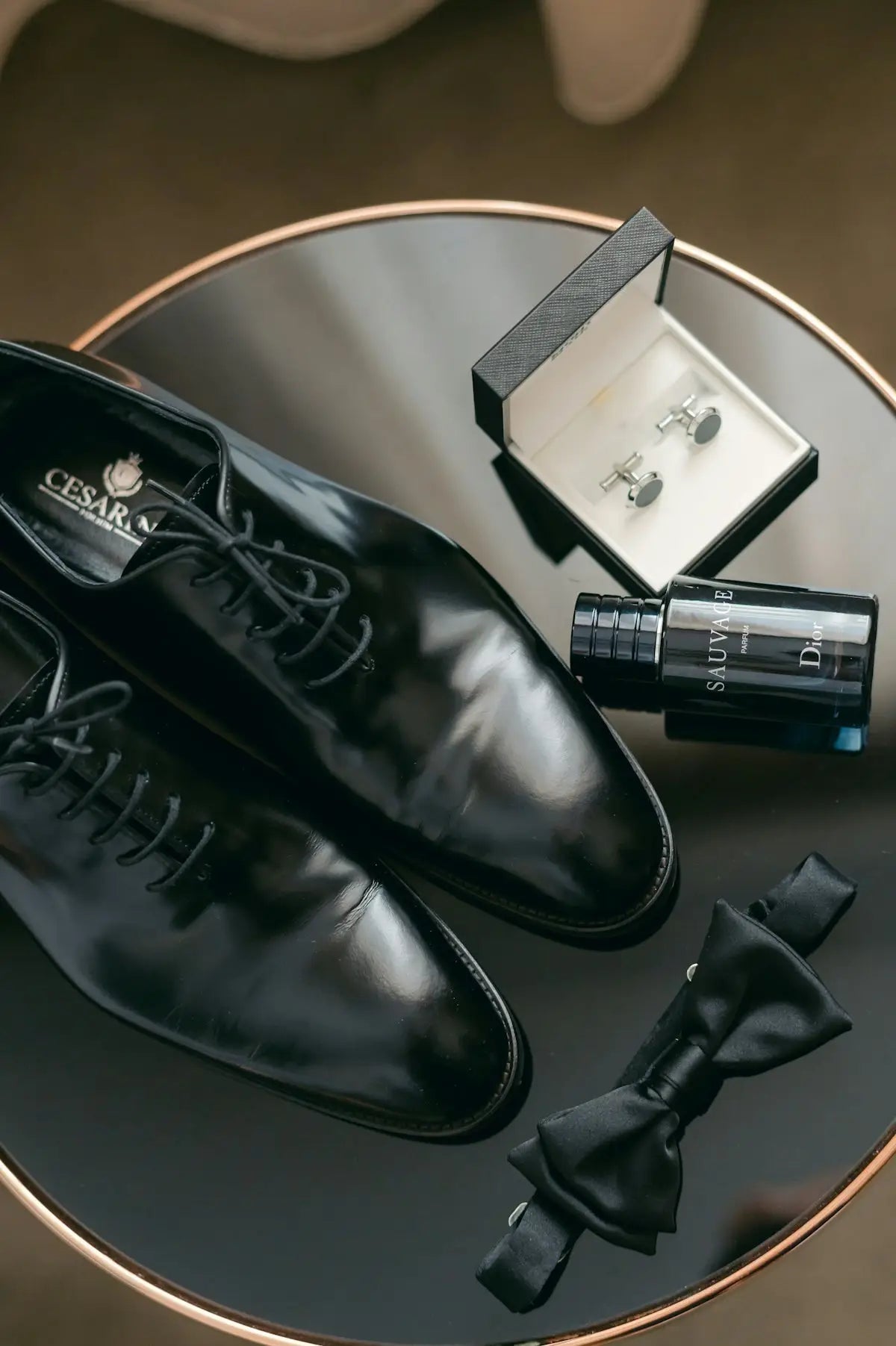 Black patent leather dress shoes with a polished finish and classic lace-up design.