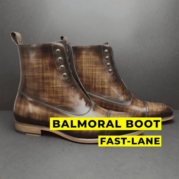 Brown leather balmoral boot with studded details and a classic design.