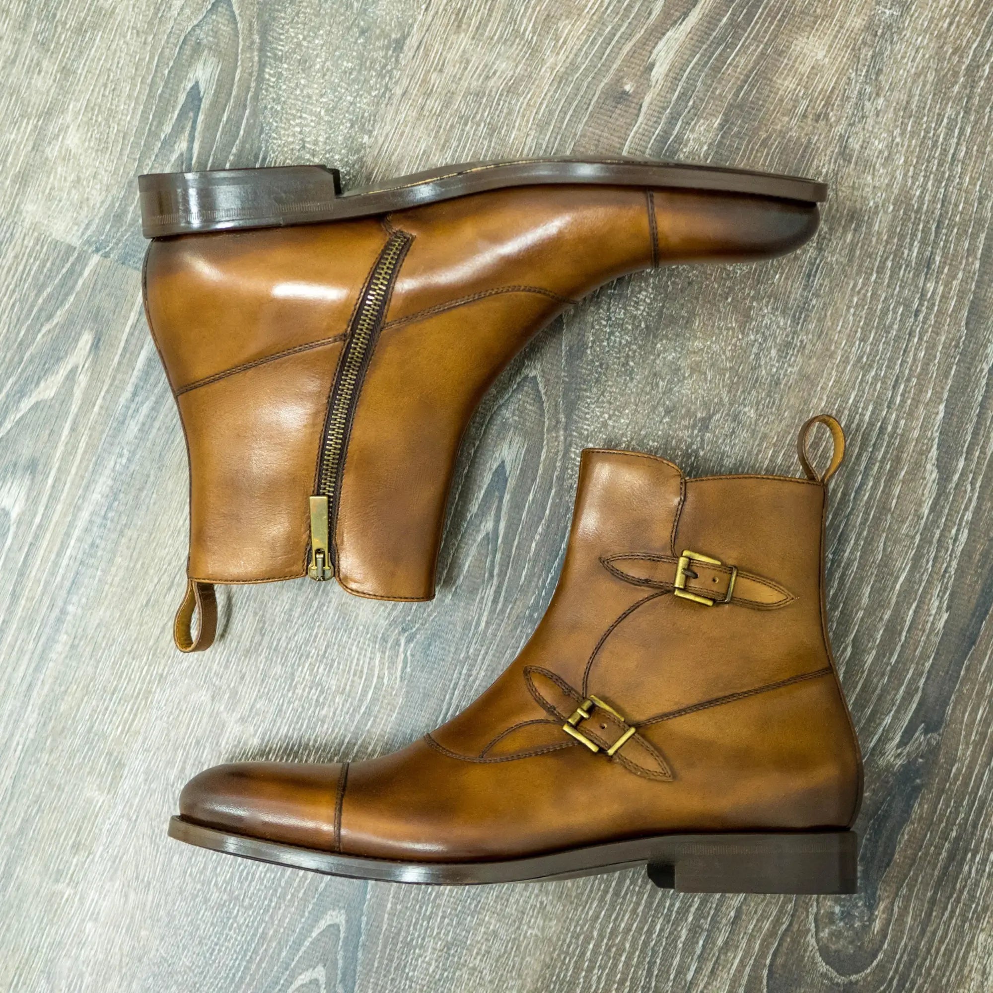 Pair of brown leather monk strap boots.
