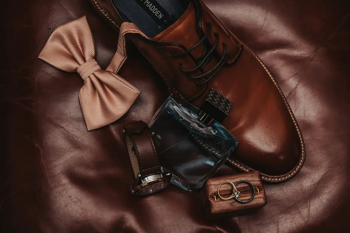 Brown leather dress shoes with laces and a polished finish.