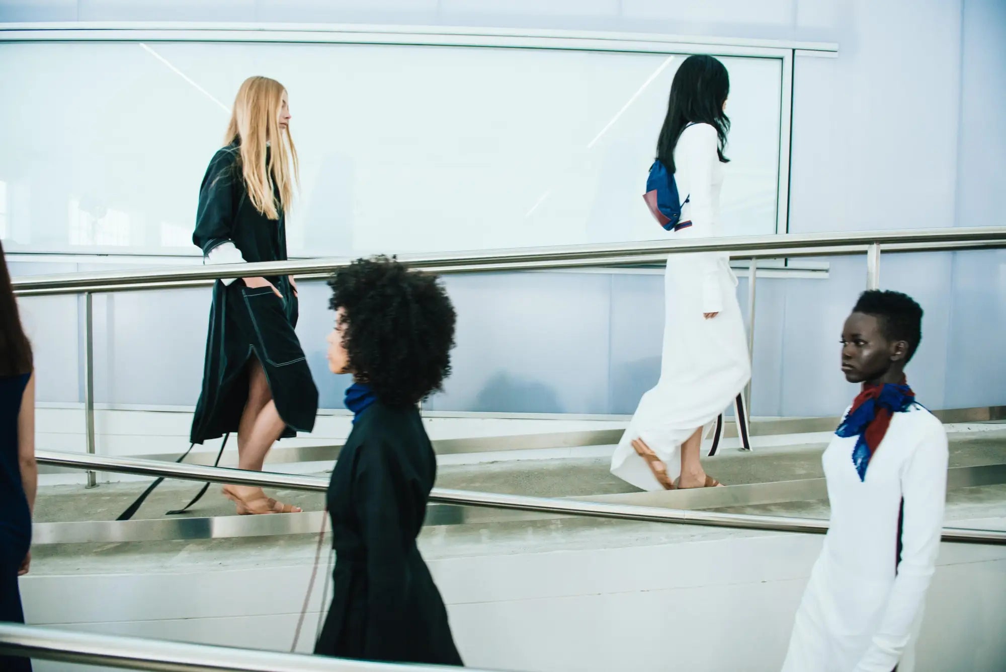 Fashion models on stairs.