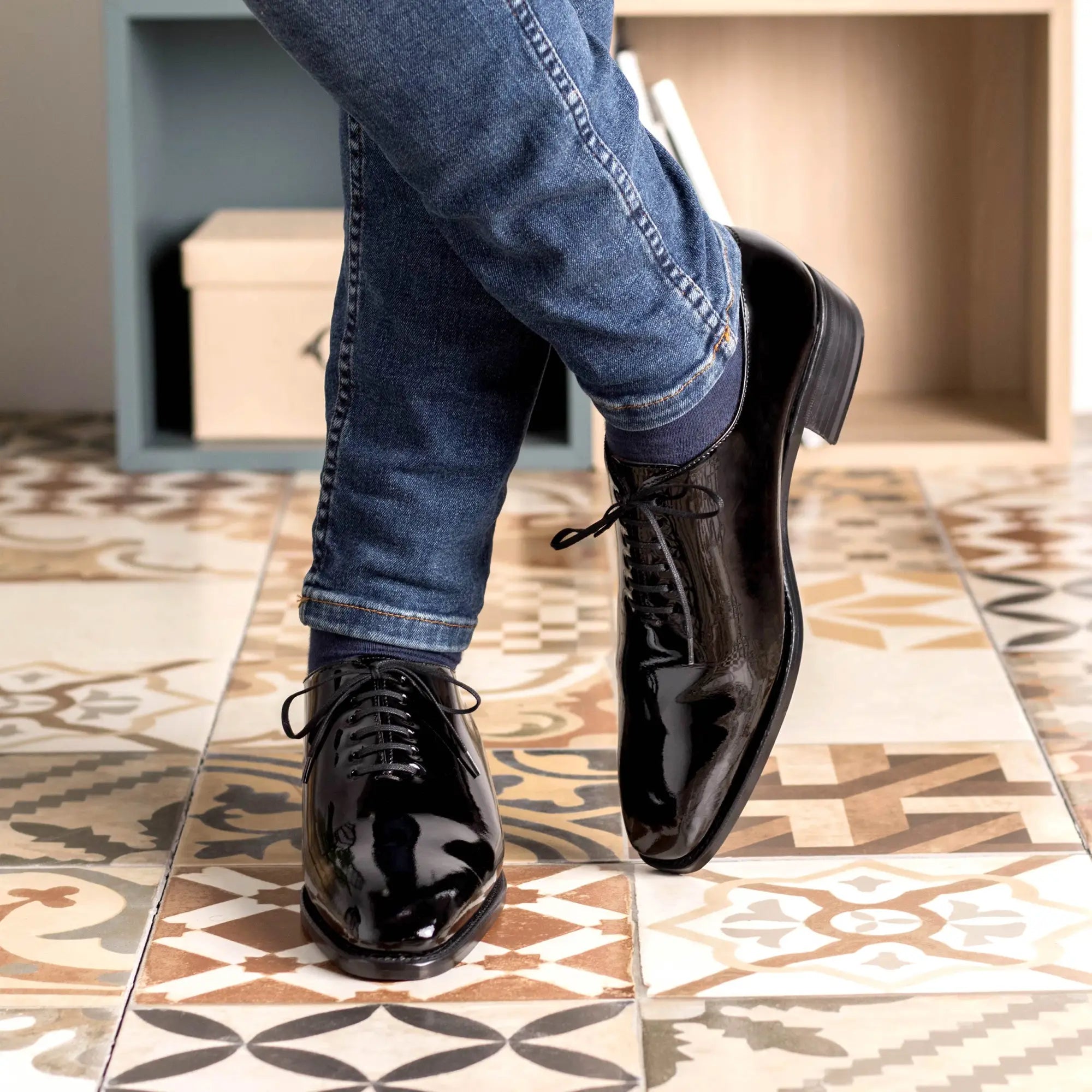 Shiny black dress shoes.