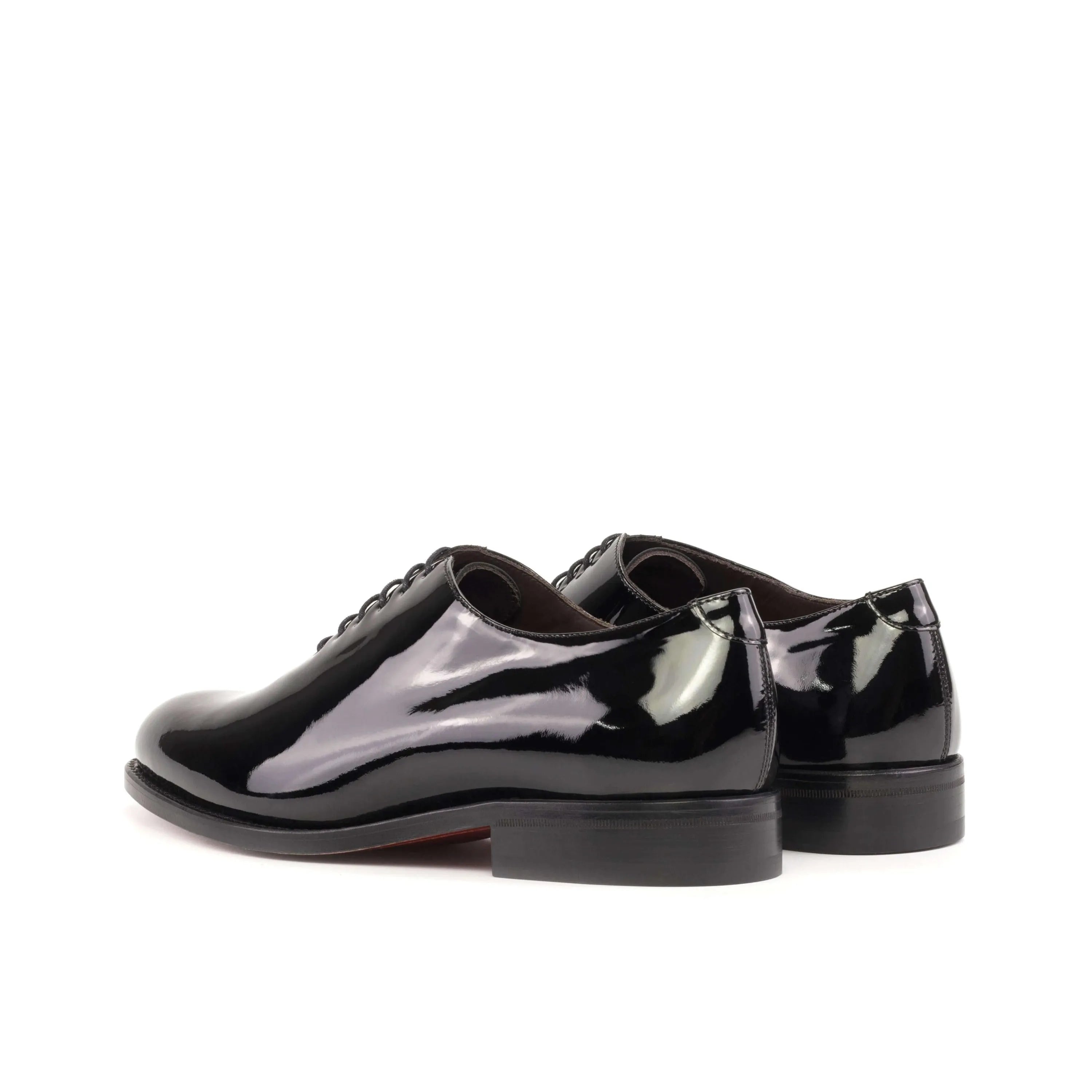 Shiny black Agent Wholecut Shoes II pair rear view