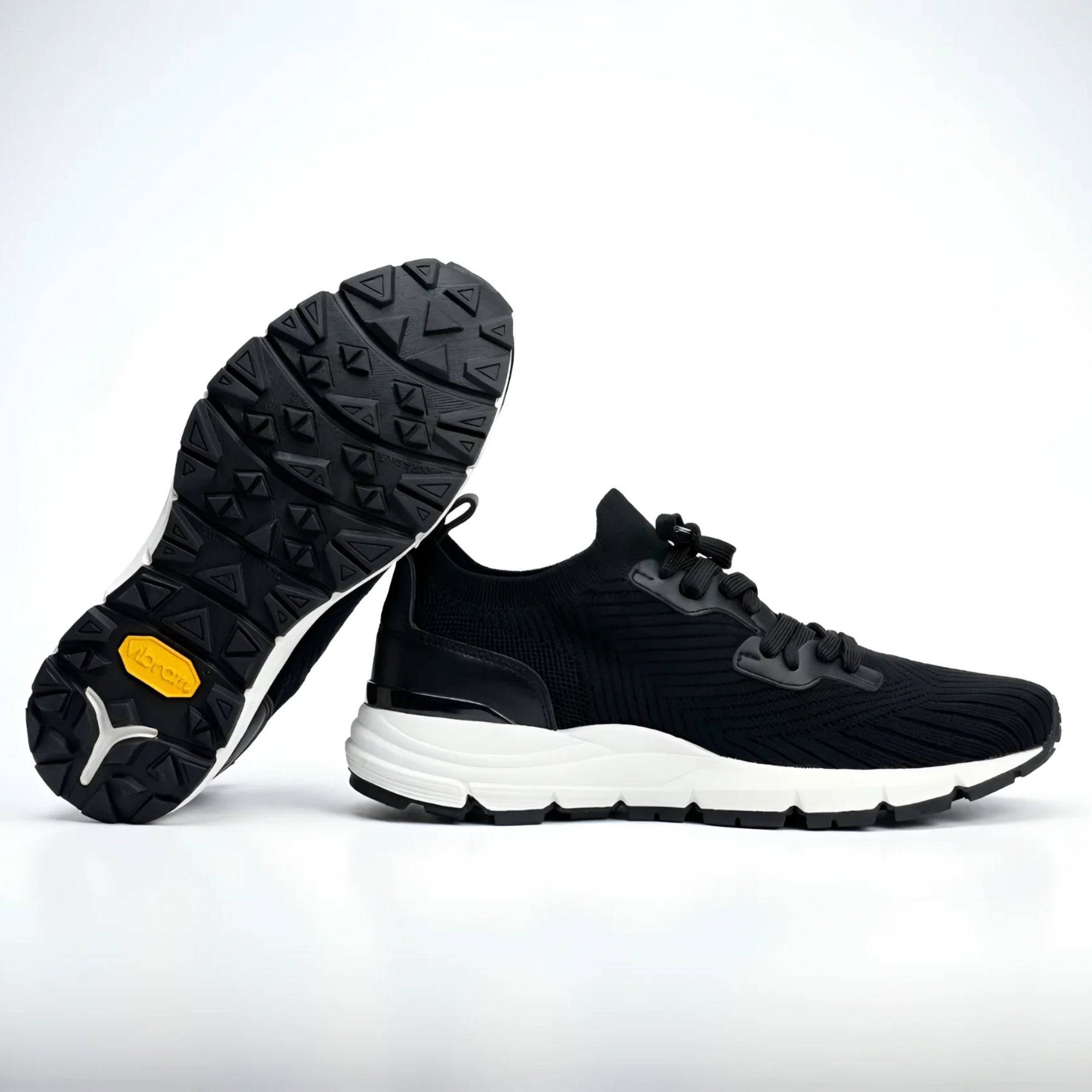 Back view of Armadillo Knit Trainer Sneaker with yellow Vibram logo on heel