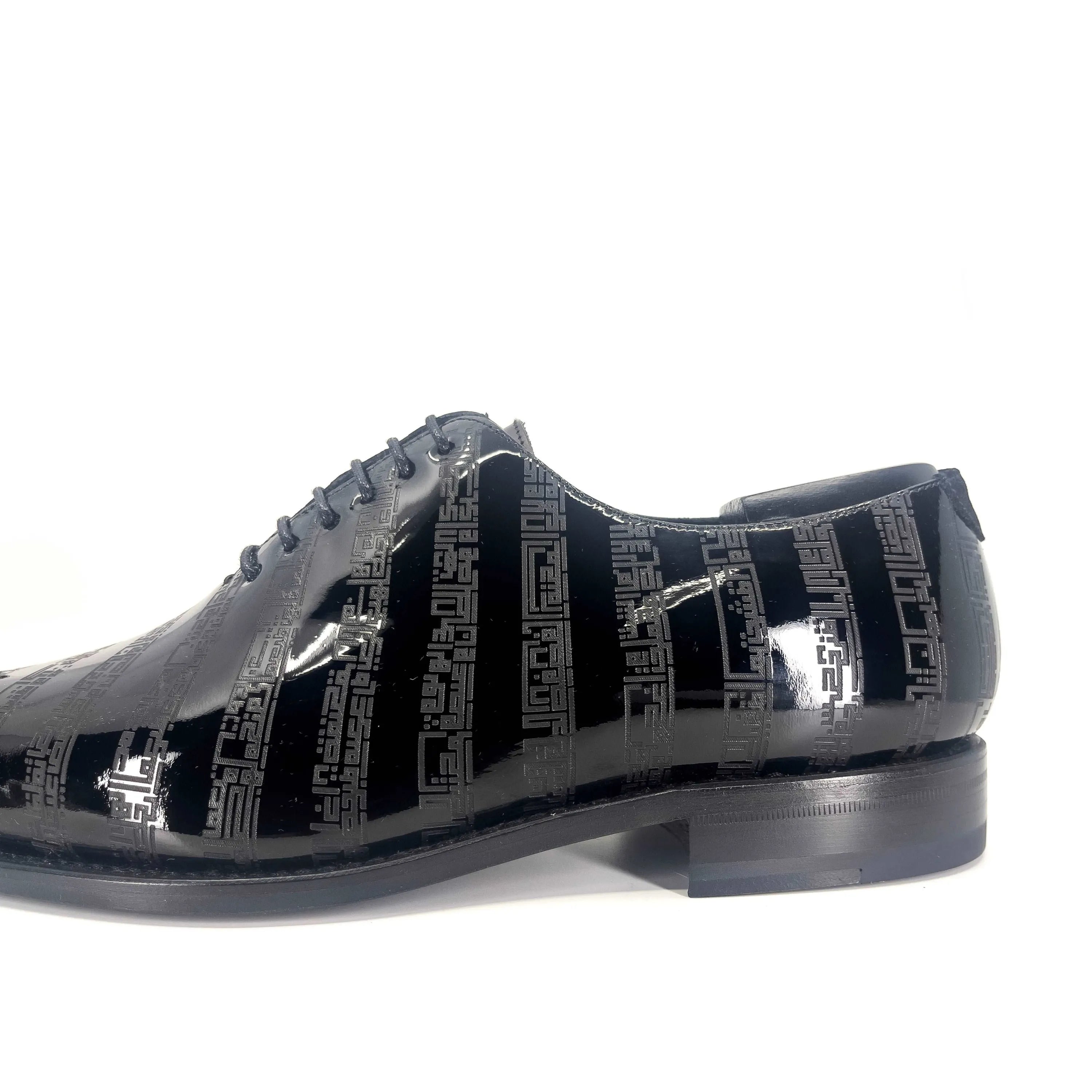 Black patent leather Before The Throne wholecut shoes with geometric pattern