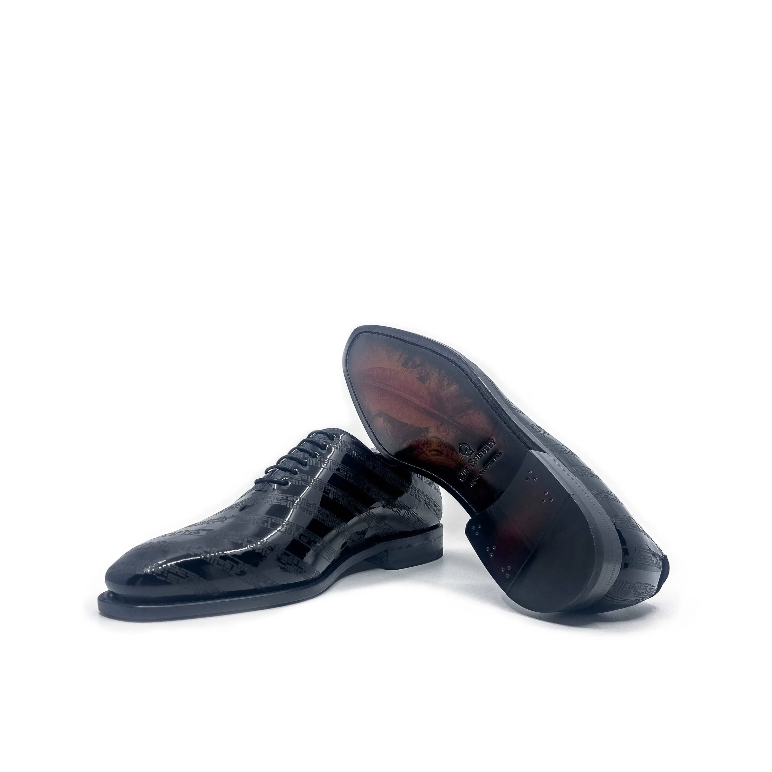 Shiny black pair of Before The Throne wholecut shoes