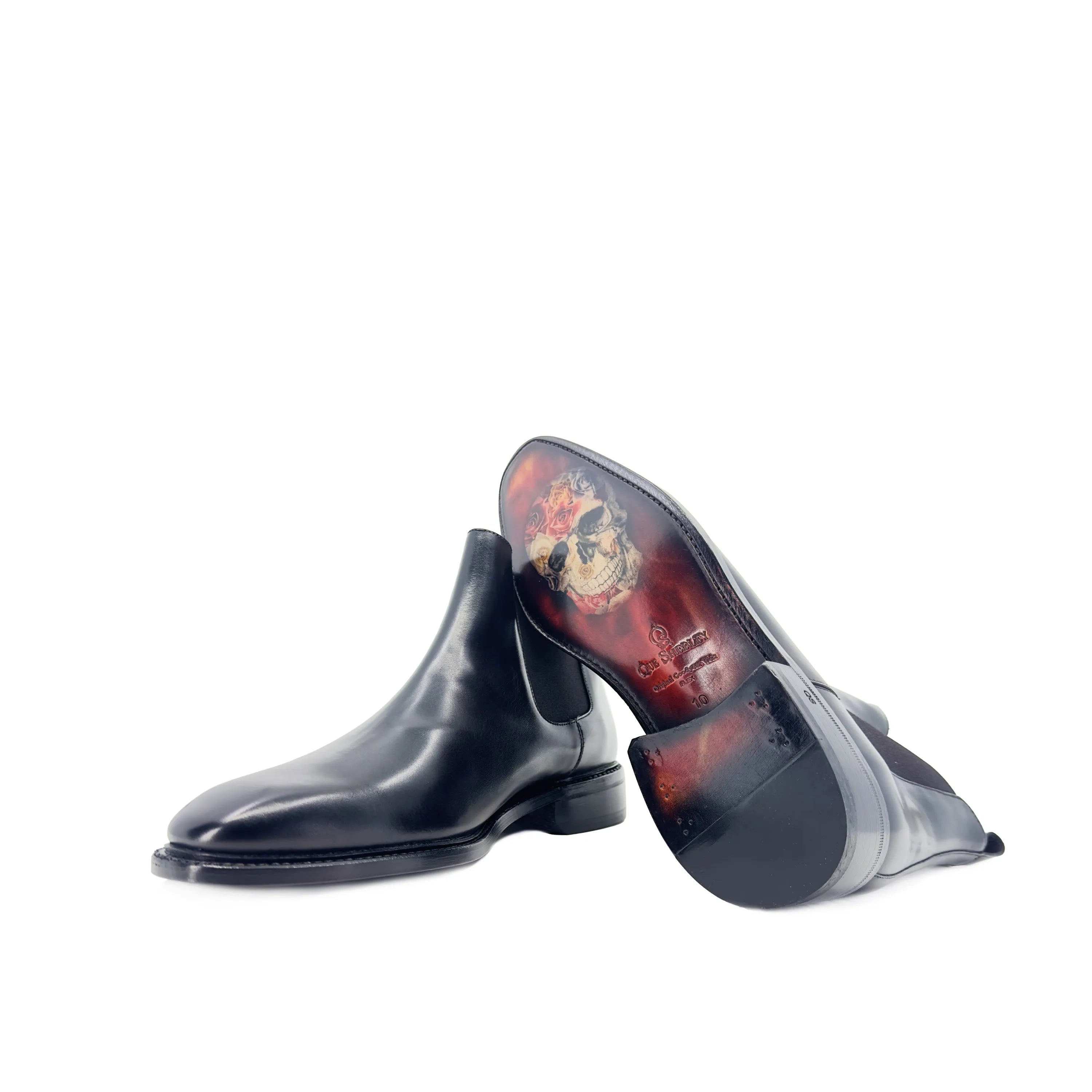 Pair of black leather Cave Chelsea Boots II with decorative soles