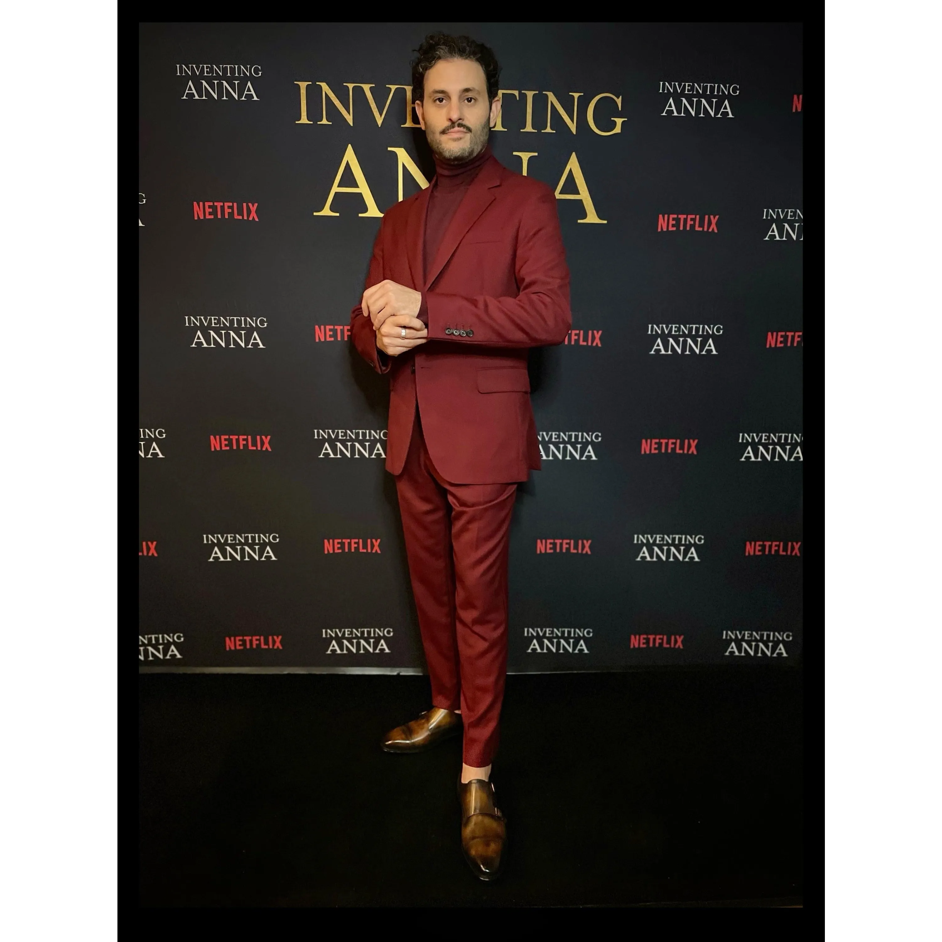 Man in burgundy suit wearing Deen double monk patina shoes