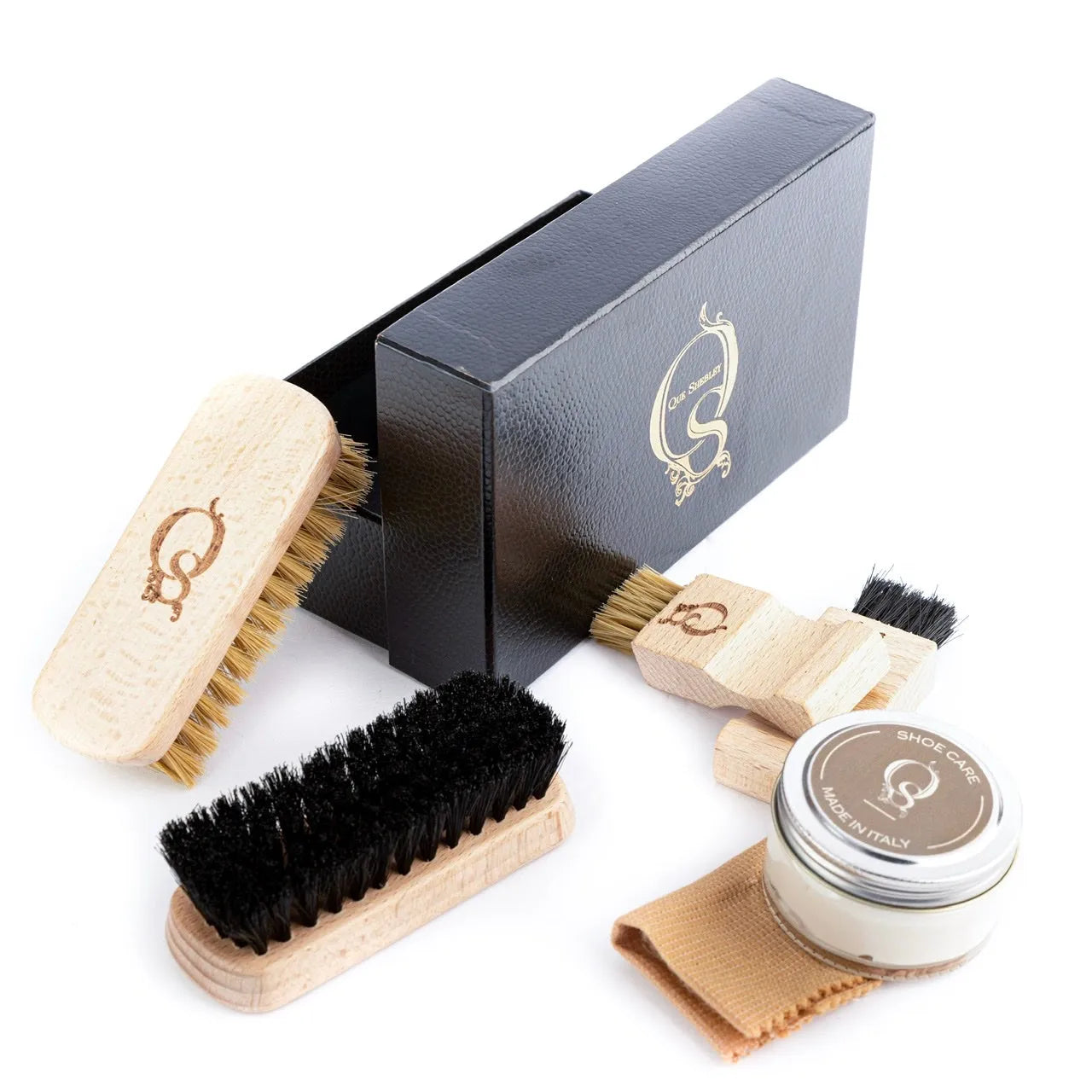 Q Lux leather care kit with brushes, polish, and cloth