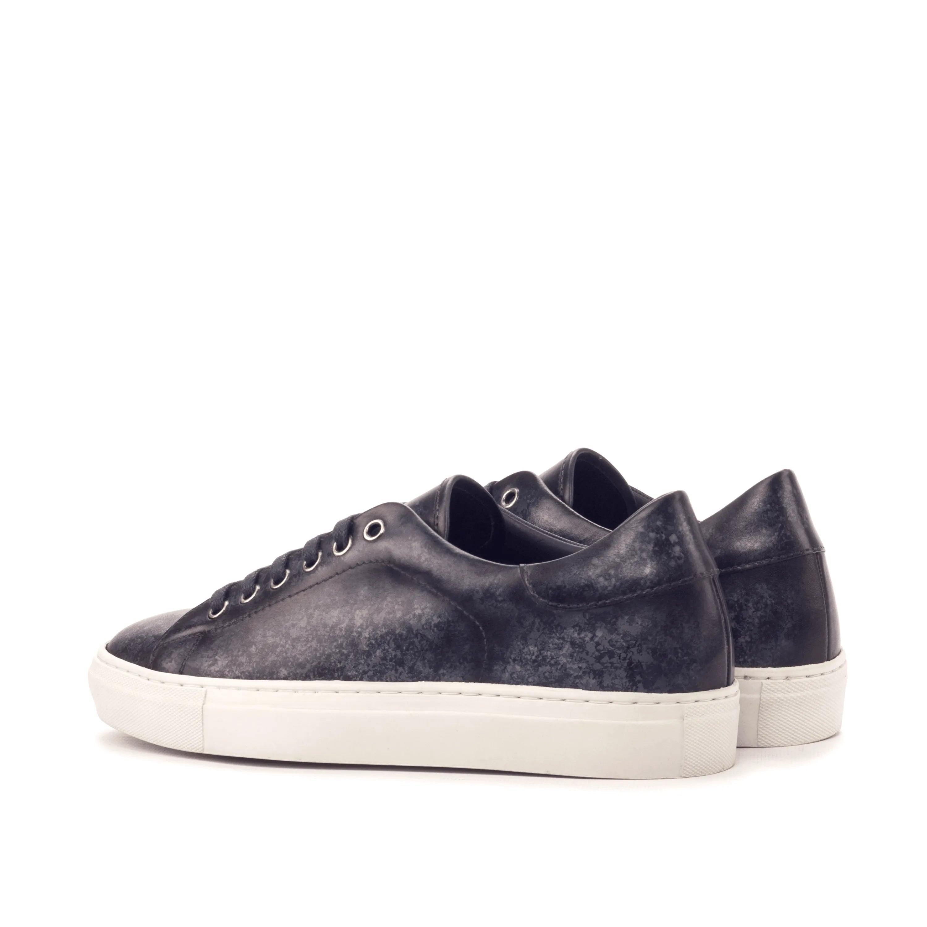 Pair of Sancho Trainer Patina sneakers with dark leather and white cupsole