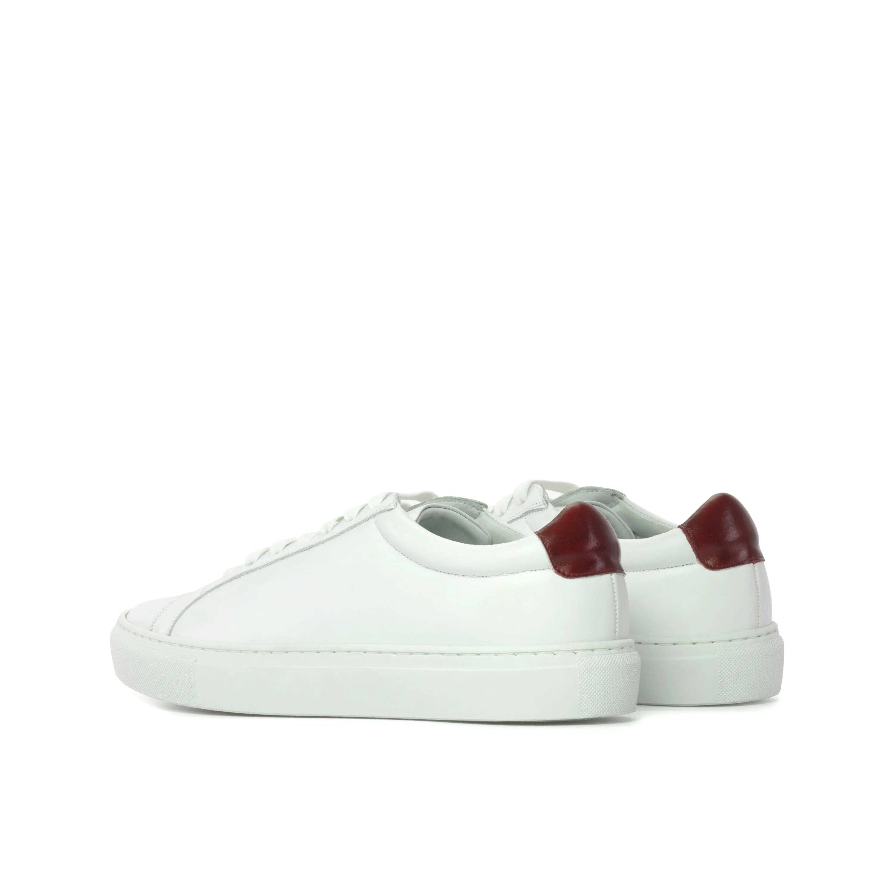 Sima low kick sneaker back view with white leather and burgundy heel