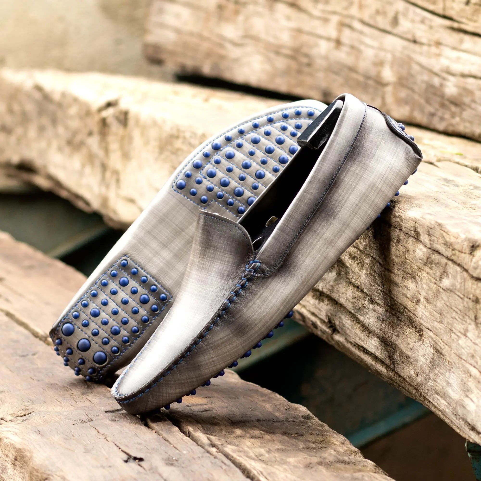 Gray leather driving shoes.