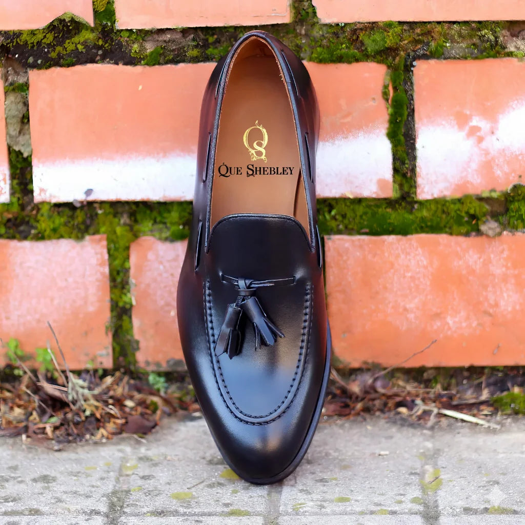 1901 Loafers black leather tassel loafer with Que Shelley branding