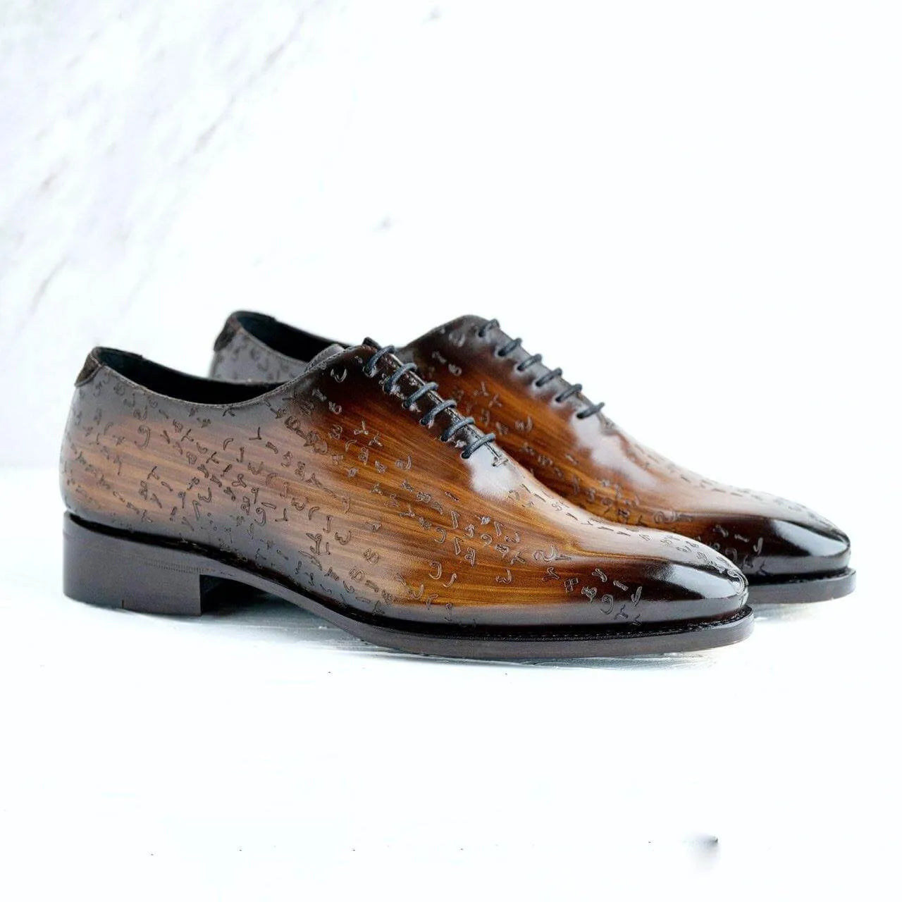 Brown Arabic matrix patina wholecut shoes in Italian crust leather