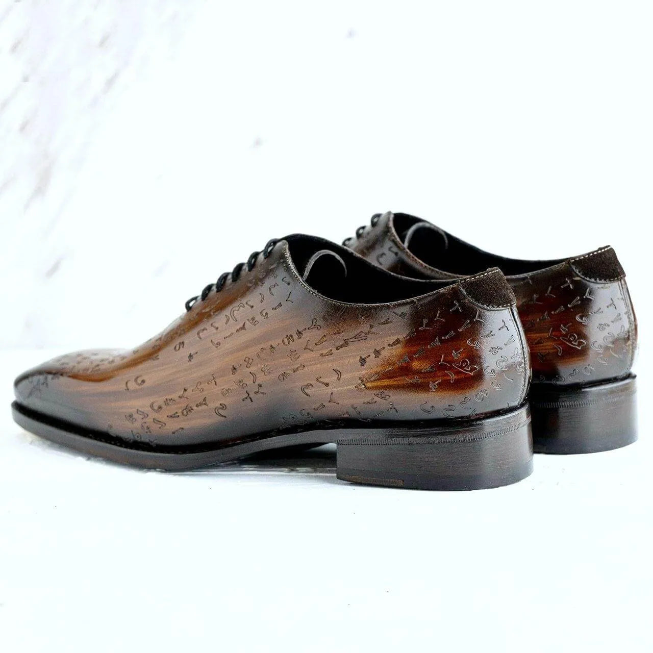 Brown Arabic matrix patina wholecut shoes in Italian crust leather