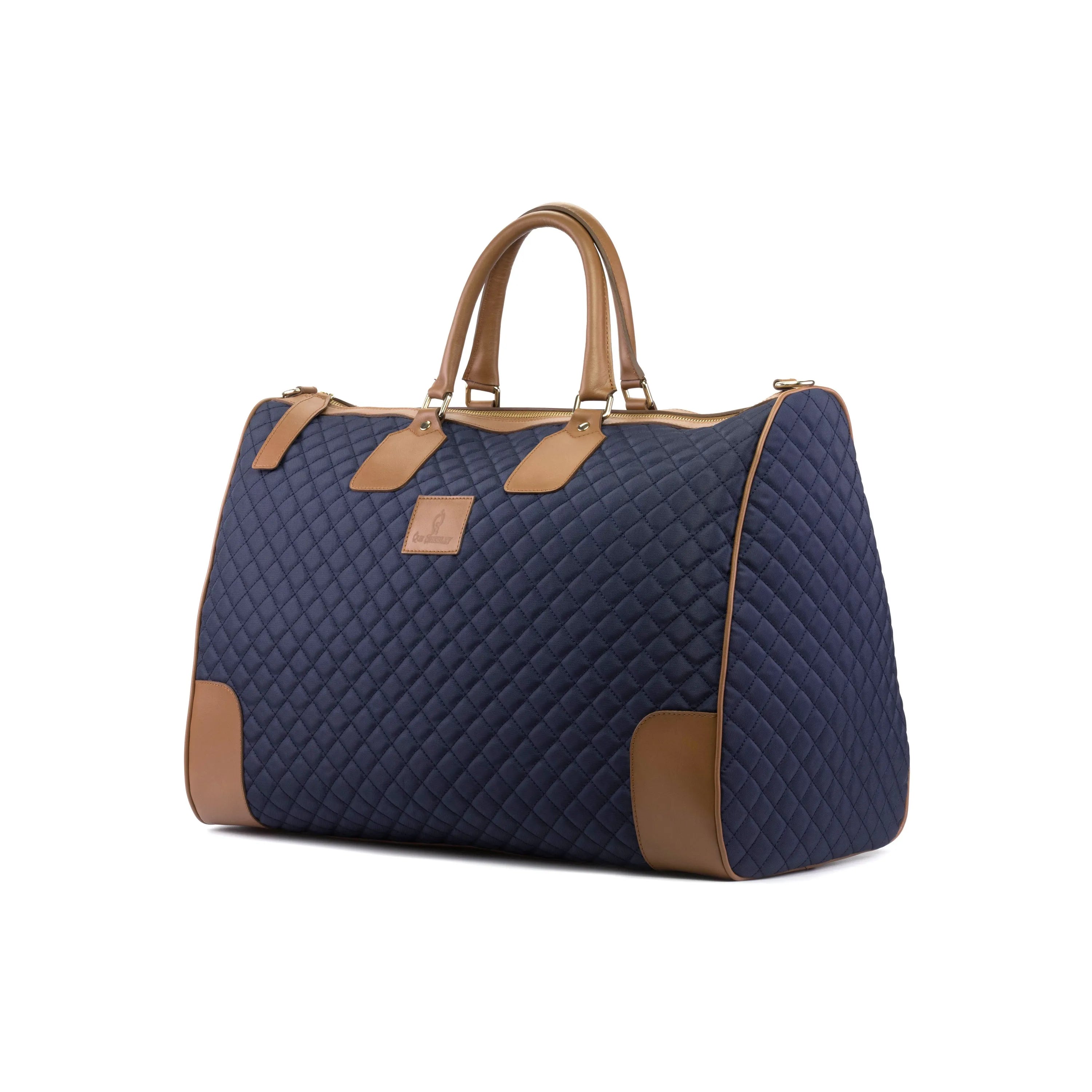 Quilted navy Donostia Weekender bag with brown leather accents for stylish travel