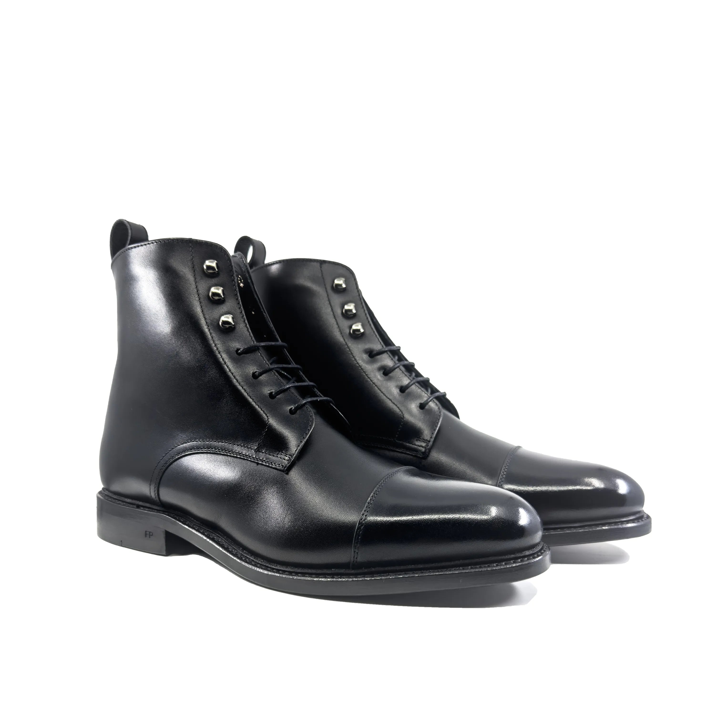 Pair of black leather FP Jumper Boots, back view