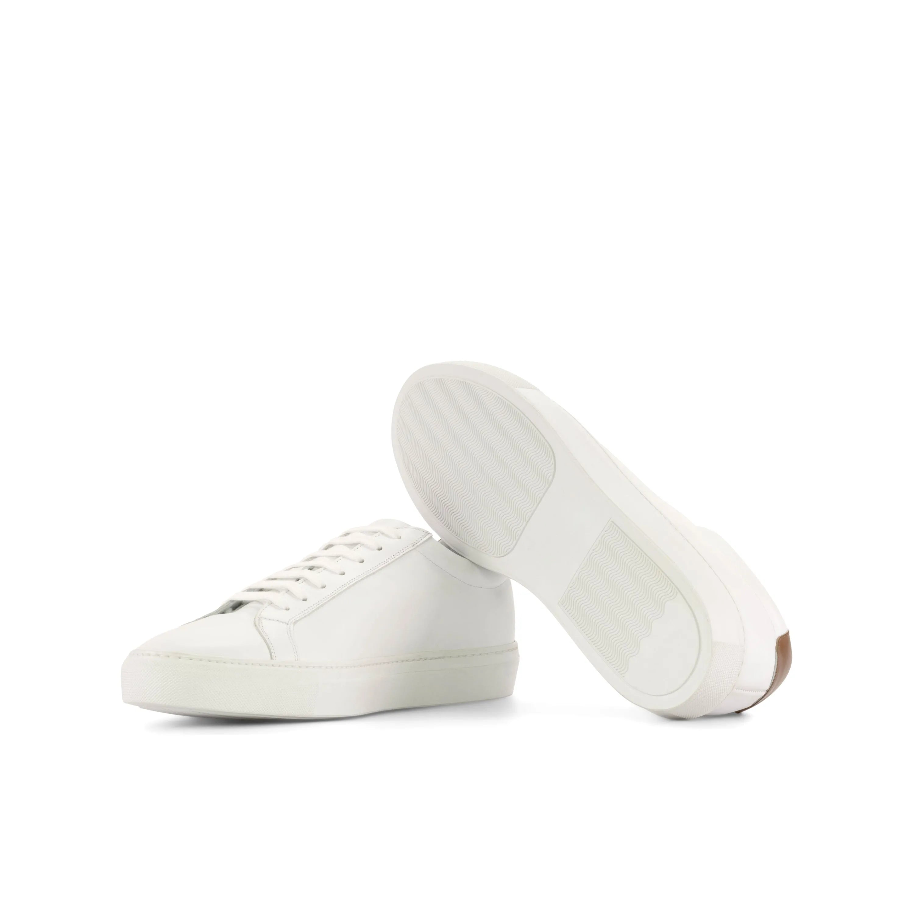 Pair of white leather Garry low kick sneakers in fast lane style