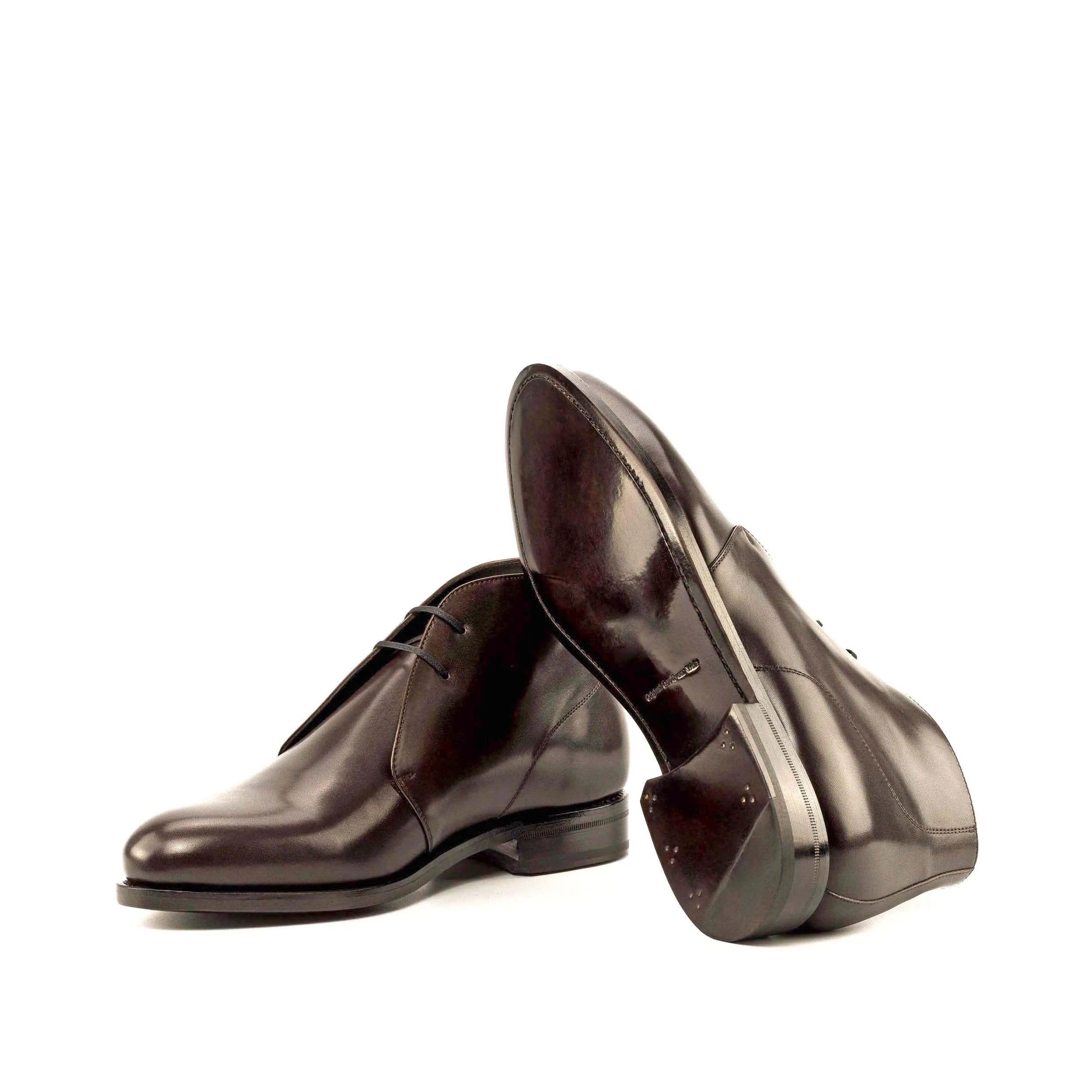 Pair of shiny brown leather Hawa Chukka boots