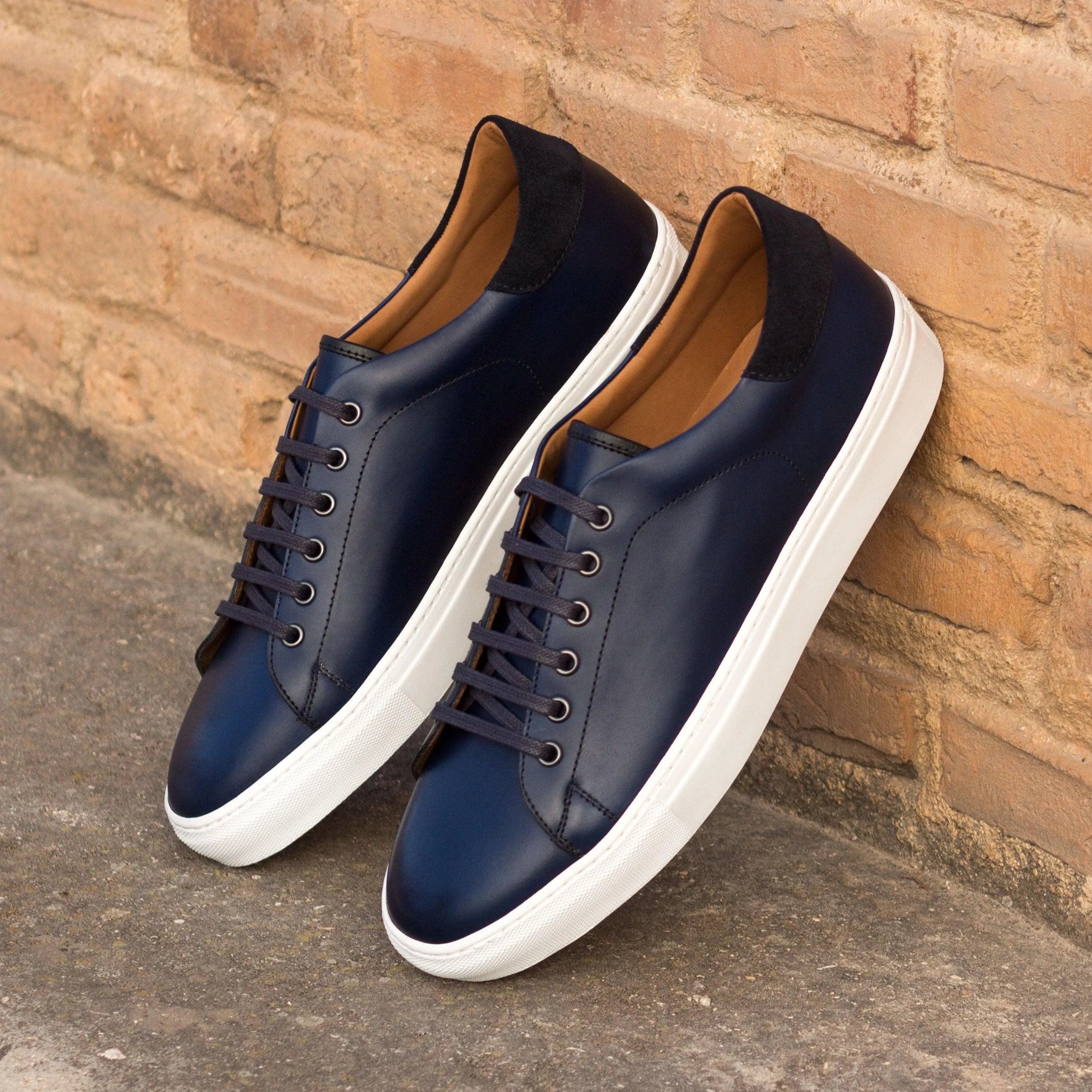 Jad Trainer navy leather sneakers with white soles