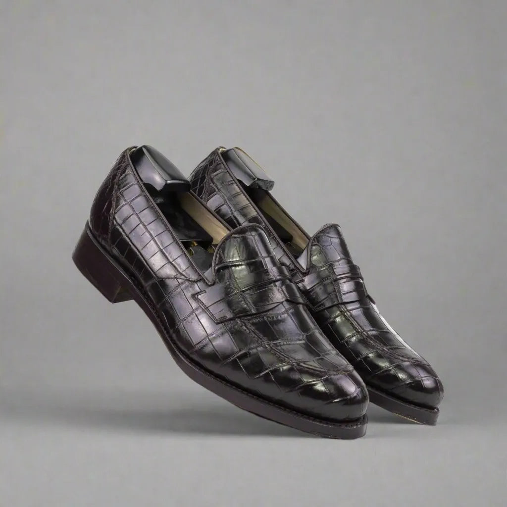 Pair of Karma Alligator Loafers II in black crocodile-patterned leather