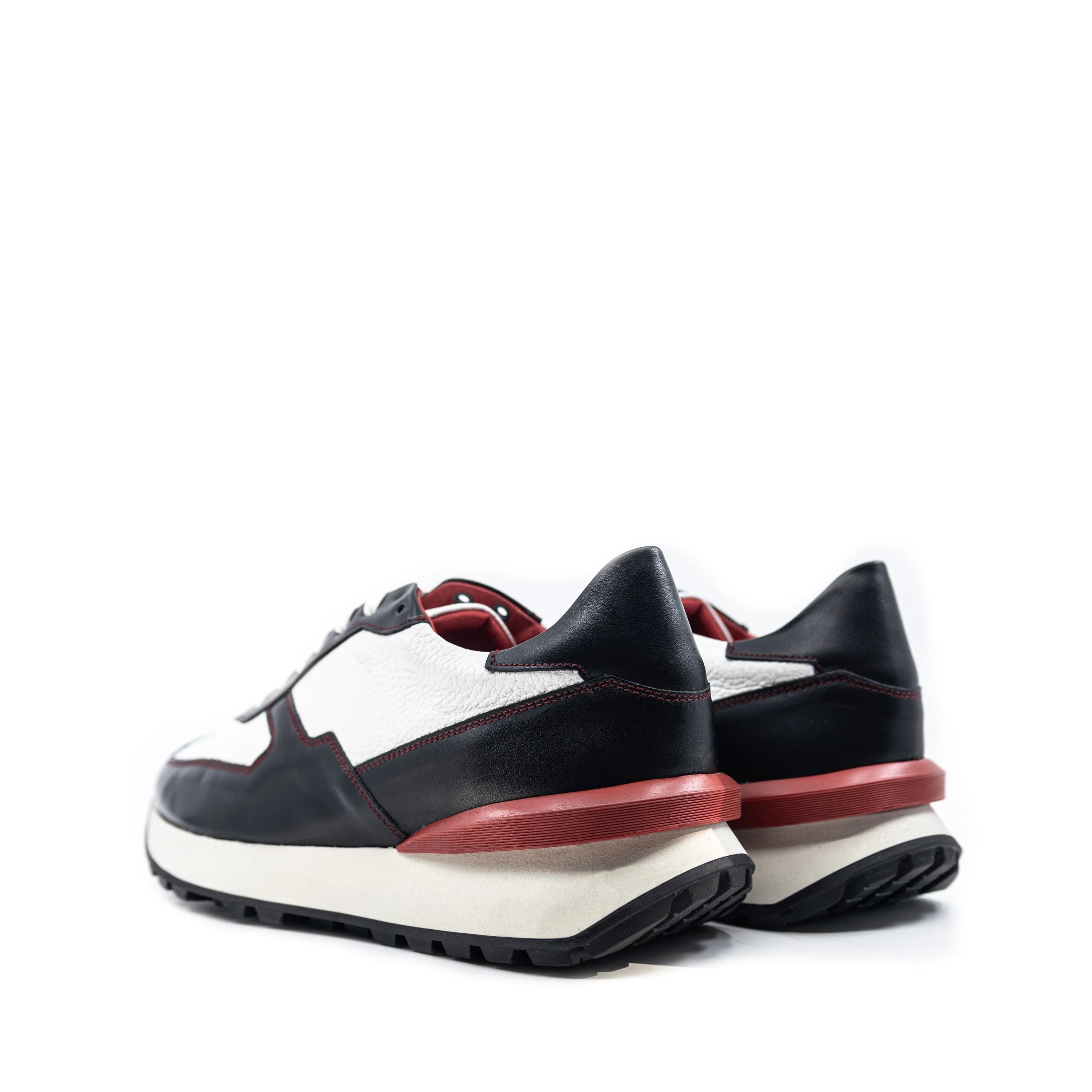 M10 Chunky Tempo Trainer Sneaker II in black and white Italian leather with red accents, exaggerated proportions