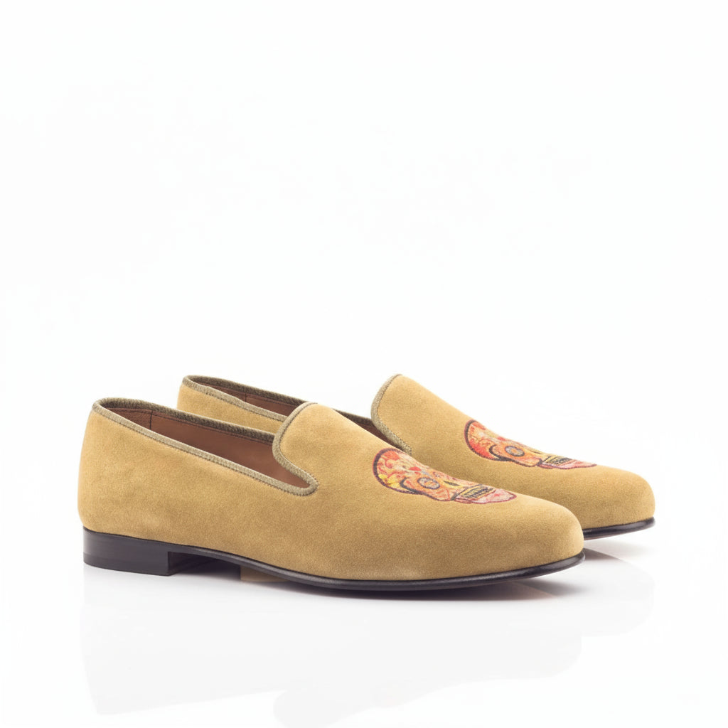 Tan suede Mizrable II Wellington slip on loafers with skull design