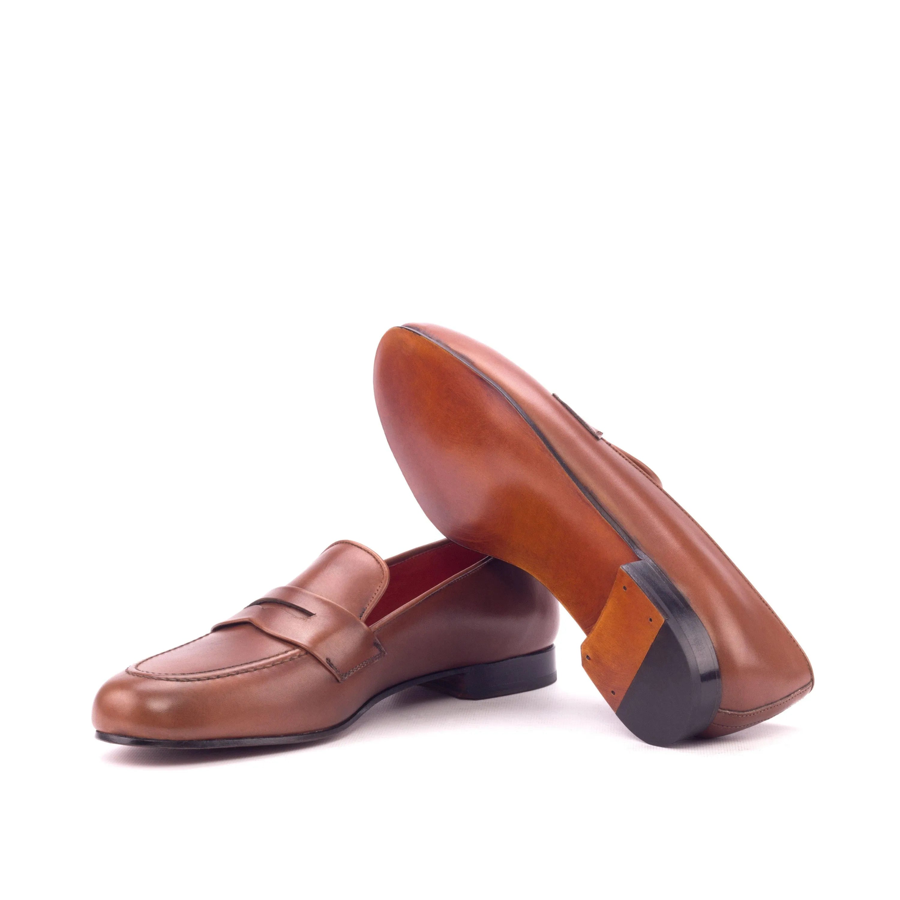 Pair of brown leather penny loafers in Monaco Wellington slipon II