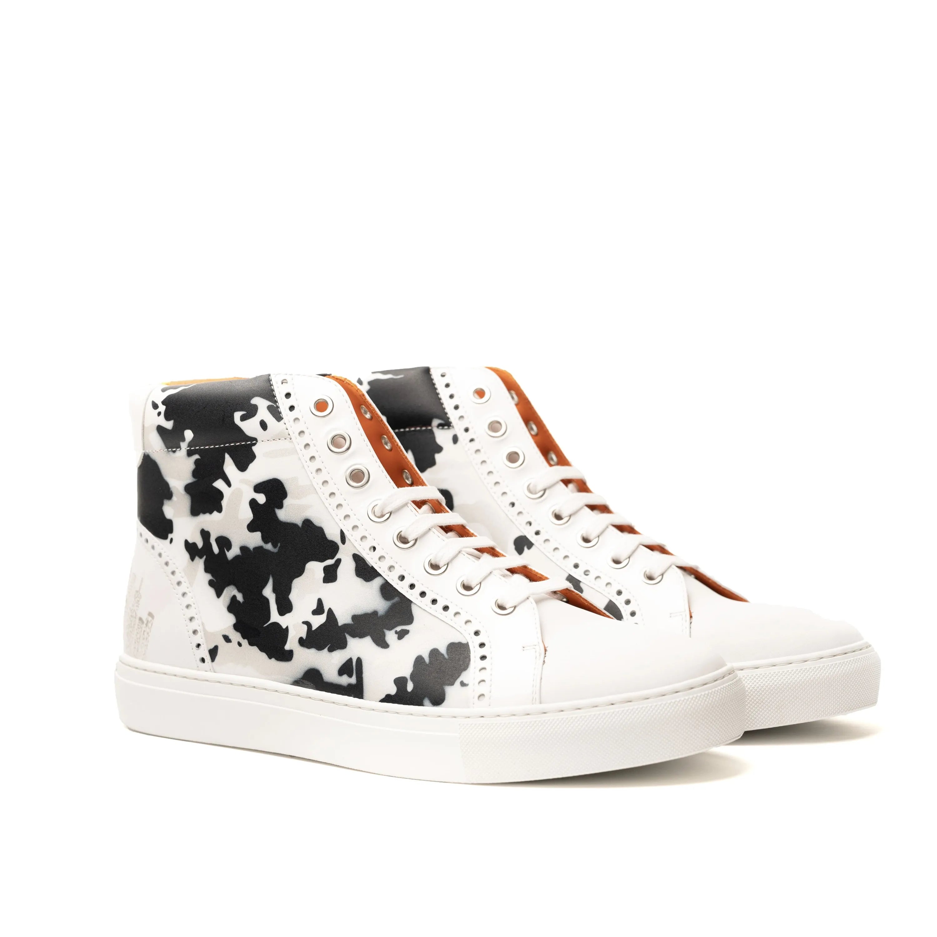 NYC High Kicks chunky trainer sneaker in white with black cow print