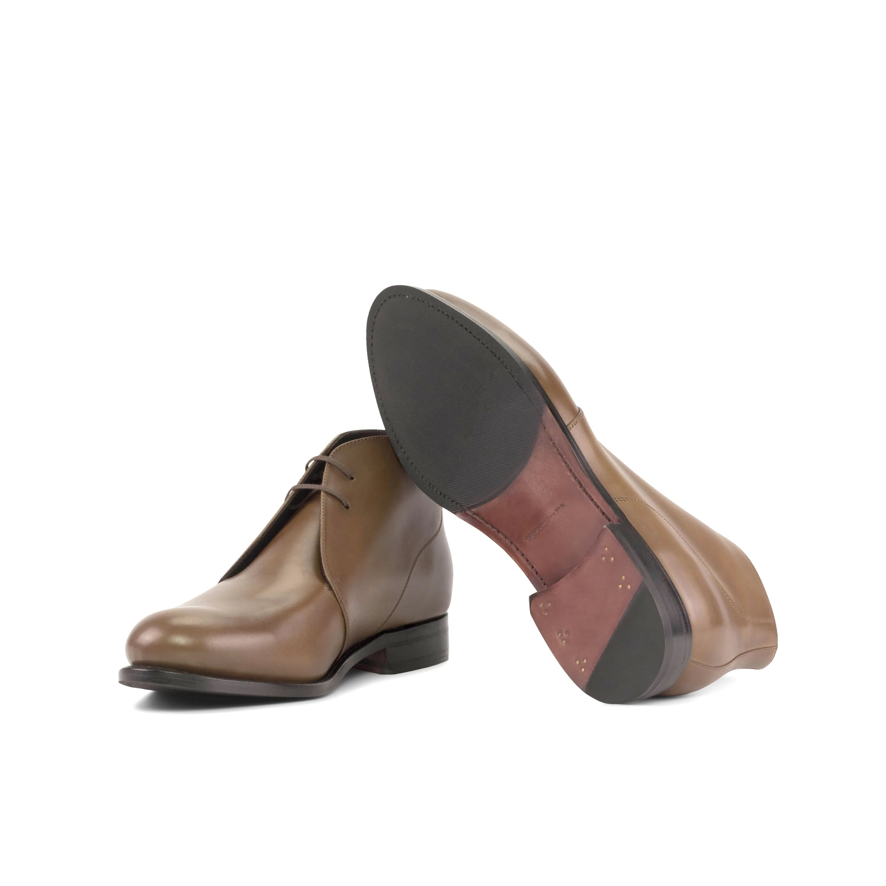 Pair of brown leather Olian Chukka boots in fast lane style