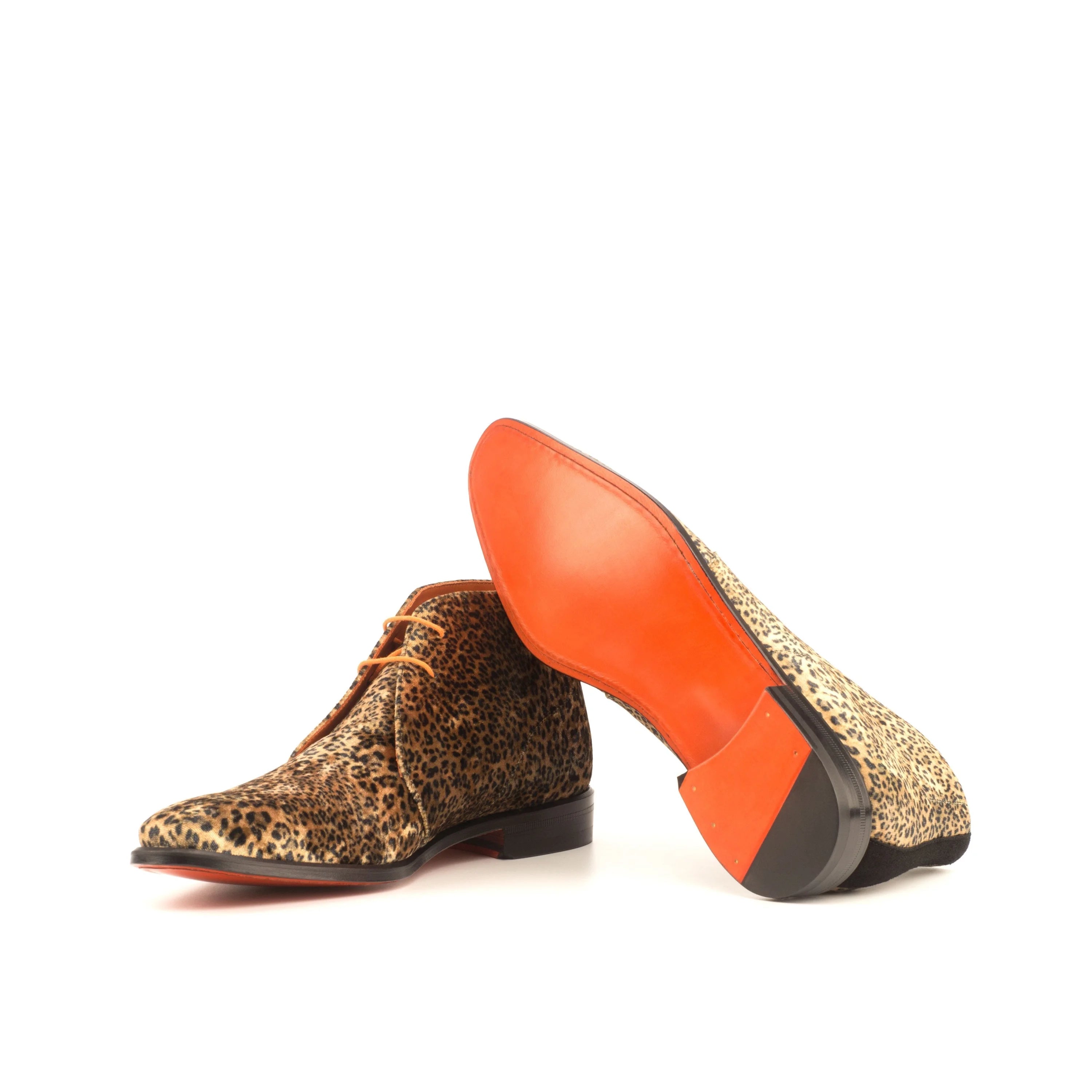 Pardo Chukka boots II in leopard print with orange soles and black heel caps