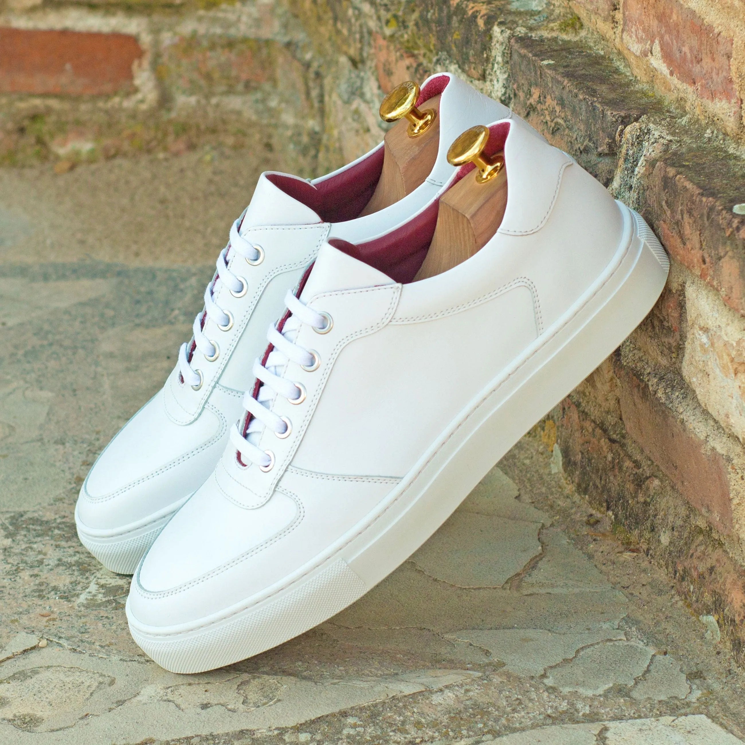 Pair of white leather snow trainer sneakers