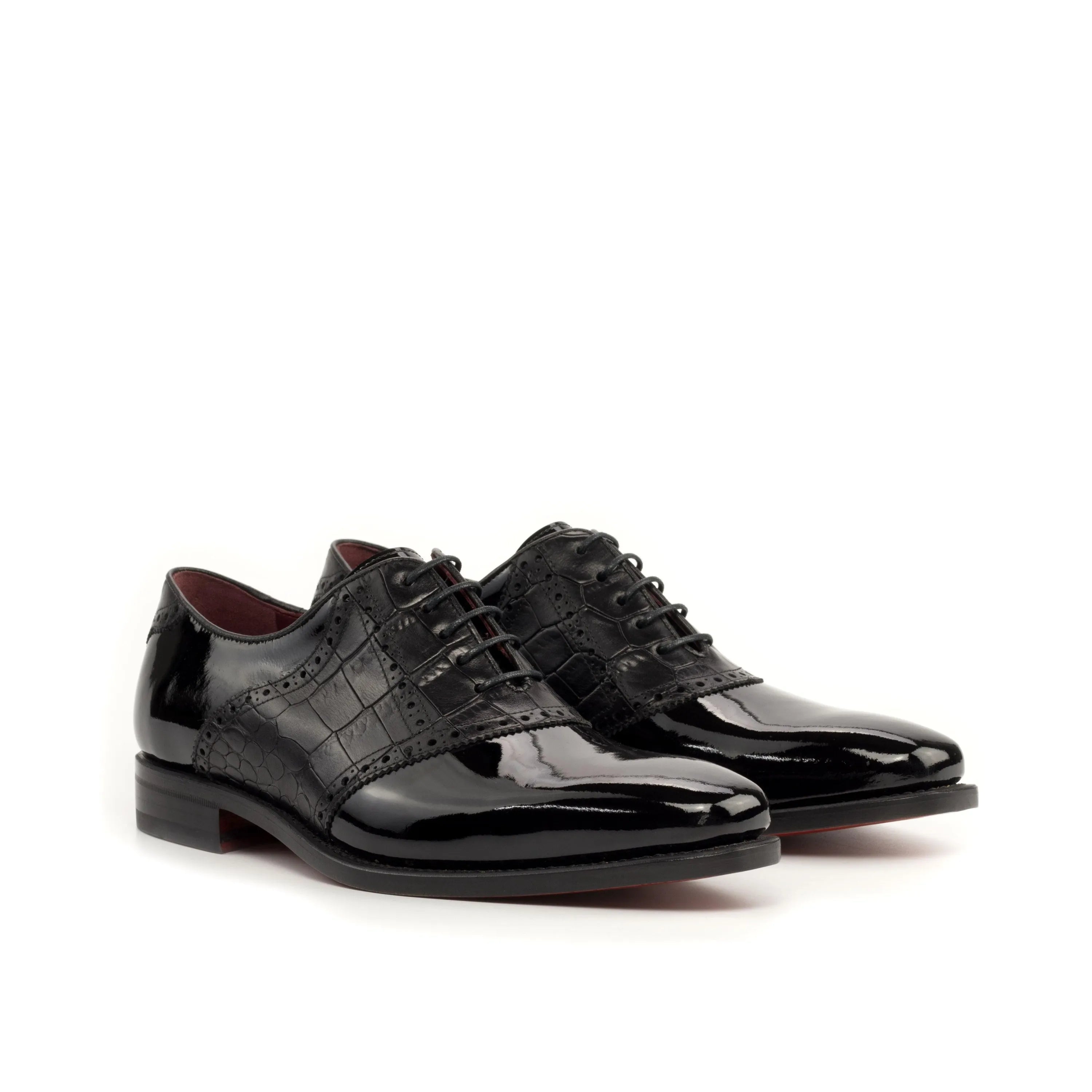 Pair of black patent leather Sorgino saddle shoes