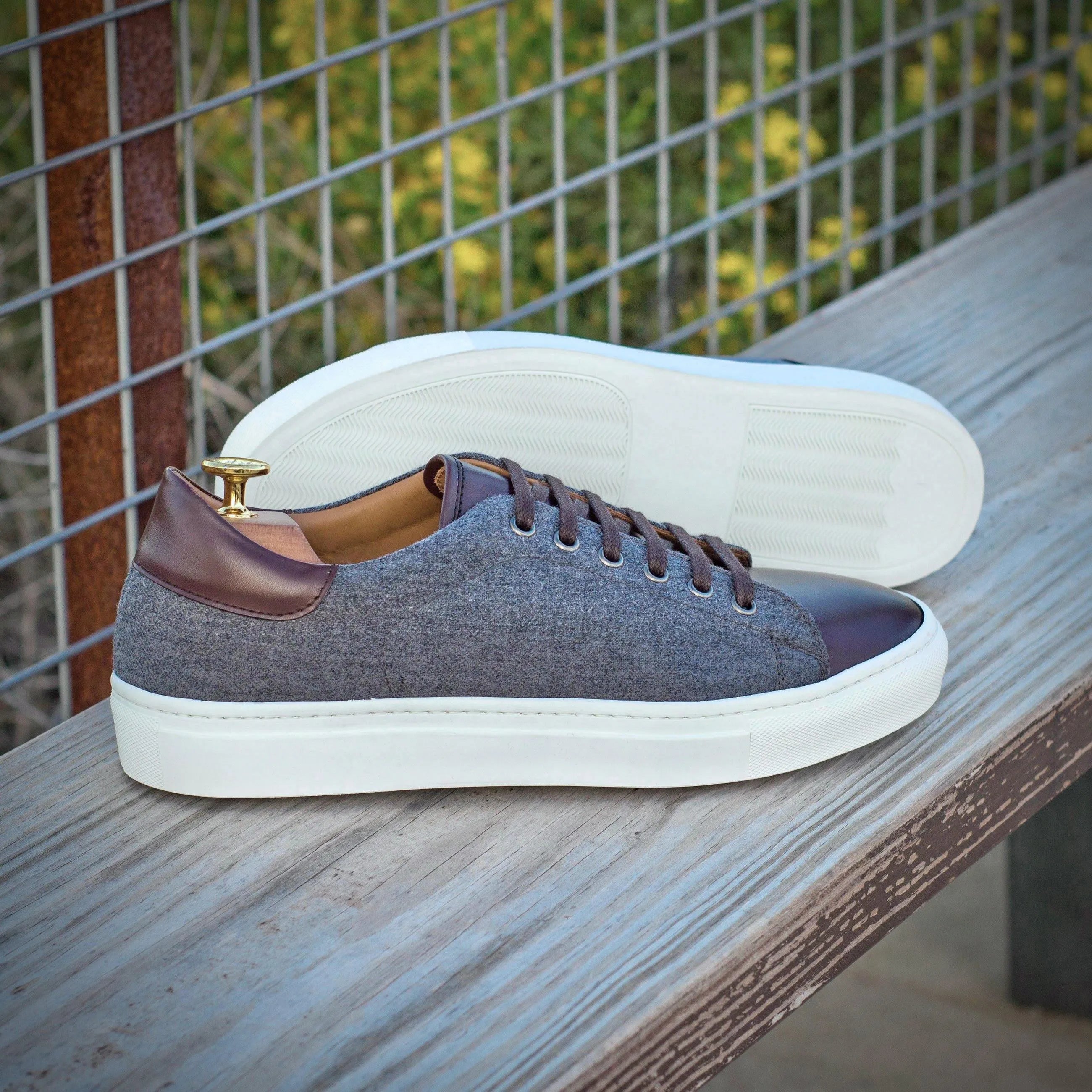 Stylish gray and brown Supera Trainer Sneakers with cupsole design